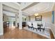 Elegant dining room with hardwood floors, tray ceiling, chandelier, and stylish furnishings at 23320 Dinhurst Ct, Land O Lakes, FL 34639