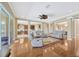 Open concept living area with access to the kitchen, dining area and outdoor living at 23320 Dinhurst Ct, Land O Lakes, FL 34639