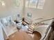 Bright living room with hardwood floors, high ceilings, comfortable seating, and an impressive staircase at 23320 Dinhurst Ct, Land O Lakes, FL 34639