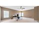 Bright office featuring neutral walls, carpet flooring, a modern ceiling fan, and two windows for natural light at 23320 Dinhurst Ct, Land O Lakes, FL 34639