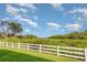 Expansive backyard offers green grass and a serene white picket fence at 2725 Terra Ceia Bay Blvd # 104, Palmetto, FL 34221