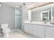 Bathroom featuring a glass-enclosed shower and dual-sink vanity with ample counter space at 2725 Terra Ceia Bay Blvd # 104, Palmetto, FL 34221