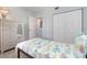 Comfortable bedroom featuring a mirror wardrobe and natural light, with neutral decor at 2725 Terra Ceia Bay Blvd # 104, Palmetto, FL 34221