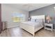 Comfortable bedroom with wood floors, a large window, and a serene atmosphere at 2725 Terra Ceia Bay Blvd # 104, Palmetto, FL 34221