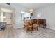 Open dining area featuring modern flooring and access to the kitchen at 2725 Terra Ceia Bay Blvd # 104, Palmetto, FL 34221