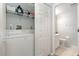 Functional laundry area with a washer, dryer, and storage shelves at 2725 Terra Ceia Bay Blvd # 104, Palmetto, FL 34221