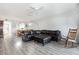Open living room with modern flooring and a large leather sectional sofa and ceiling fan at 2725 Terra Ceia Bay Blvd # 104, Palmetto, FL 34221