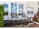 Private patio with chairs and a beautiful garden view, perfect for outdoor relaxation at 2725 Terra Ceia Bay Blvd # 104, Palmetto, FL 34221