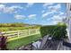 Inviting patio features chairs, a wood deck, and a picturesque green space view at 2725 Terra Ceia Bay Blvd # 104, Palmetto, FL 34221