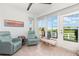 Bright sunroom featuring tile floors, comfortable armchairs, and a view of the outdoors at 2725 Terra Ceia Bay Blvd # 104, Palmetto, FL 34221