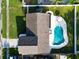 Birds eye view of a property with a pool and well-manicured lawn at 2897 Rosery Ne Rd, Largo, FL 33771