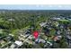 Aerial view of a home marked with a pin, surrounded by a neighborhood with greenery and trees at 2897 Rosery Ne Rd, Largo, FL 33771