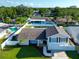 An aerial view of a charming two-story home with landscaped yard in a residential area at 2897 Rosery Ne Rd, Largo, FL 33771