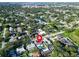 A lush, landscaped property showcases a private pool, complemented by the surrounding community and serene waterway at 2897 Rosery Ne Rd, Largo, FL 33771