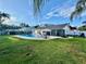 Spacious backyard with a refreshing pool, perfect for outdoor gatherings and relaxation at 2897 Rosery Ne Rd, Largo, FL 33771