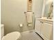 Well-appointed bathroom with a stylish vanity and classic black-and-white tile flooring at 2897 Rosery Ne Rd, Largo, FL 33771