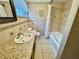 Bathroom with tiled walls, single sink vanity and a bathtub at 2897 Rosery Ne Rd, Largo, FL 33771