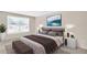 Stylishly decorated bedroom with a comfortable bed and bench at 2897 Rosery Ne Rd, Largo, FL 33771
