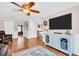The home includes a ceiling fan, hardwood flooring, and a flat screen TV at 2897 Rosery Ne Rd, Largo, FL 33771