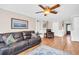 Spacious living room with ceiling fan, hardwood flooring, and comfortable seating at 2897 Rosery Ne Rd, Largo, FL 33771