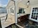 Outdoor patio bar with chairs and a view of the pool area at 2897 Rosery Ne Rd, Largo, FL 33771