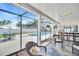 Enclosed outdoor patio and bar with views of the pool, perfect for entertaining guests at 2897 Rosery Ne Rd, Largo, FL 33771