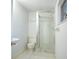 Bright bathroom features a sink, toilet, and glass-enclosed shower at 290 13Th N Ave, Safety Harbor, FL 34695