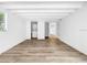Bedroom featuring wood floors, white walls, laundry, and closet space at 290 13Th N Ave, Safety Harbor, FL 34695