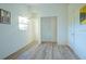 Empty bedroom showcases neutral walls, closet and an open doorway at 290 13Th N Ave, Safety Harbor, FL 34695