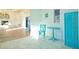 Bright entryway with tile flooring, a turquoise table, and an open view into the living room at 290 13Th N Ave, Safety Harbor, FL 34695