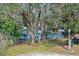 Charming single-story home with a well-maintained front yard and mature trees at 290 13Th N Ave, Safety Harbor, FL 34695