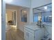 A view from the kitchenette to the pool area featuring neutral paint and ample natural light at 290 13Th N Ave, Safety Harbor, FL 34695