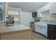 Kitchenette includes a stainless steel oven and dishwasher with plenty of storage at 290 13Th N Ave, Safety Harbor, FL 34695