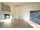 Spacious living room with a fireplace, hardwood floors, and views of the pool at 290 13Th N Ave, Safety Harbor, FL 34695