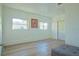 Clean, bright living room with hardwood floors, recessed lighting and two large windows at 290 13Th N Ave, Safety Harbor, FL 34695