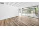 Stylish interior with wood floors and sliding glass doors to the pool area at 290 13Th N Ave, Safety Harbor, FL 34695