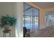 A view of the pool from inside the home, featuring neutral paint and hardwood floors at 290 13Th N Ave, Safety Harbor, FL 34695