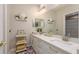 Bathroom features a double vanity, a large mirror, and ample storage at 3042 Wentworth Way, Tarpon Springs, FL 34688