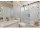 Bright bathroom featuring a walk-in shower, glass door, and granite vanity at 3042 Wentworth Way, Tarpon Springs, FL 34688