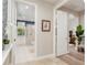 Hallway view leading to bathroom featuring walk-in shower at 3042 Wentworth Way, Tarpon Springs, FL 34688