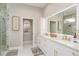 Modern bathroom with a double vanity, white cabinets, and luxurious finishes, providing a spa-like experience at 3042 Wentworth Way, Tarpon Springs, FL 34688