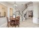 Dining nook with adjacent open staircase and view of game room at 3042 Wentworth Way, Tarpon Springs, FL 34688
