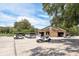 Golf cart parking near a stone building with a clock, perfect for outdoor activities at 3042 Wentworth Way, Tarpon Springs, FL 34688