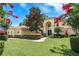 Inviting home showcasing a well-manicured lawn and lush landscaping at 3042 Wentworth Way, Tarpon Springs, FL 34688