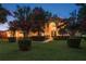 Beautiful home with manicured lawn and vibrant trees, offering great curb appeal at 3042 Wentworth Way, Tarpon Springs, FL 34688