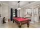 Well-appointed game room with a pool table and a wet bar at 3042 Wentworth Way, Tarpon Springs, FL 34688