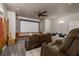 Media room featuring a large projector screen, comfortable seating, and overhead lighting at 3042 Wentworth Way, Tarpon Springs, FL 34688