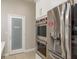 Kitchen featuring stainless steel appliances, a pantry, and marble countertops at 3042 Wentworth Way, Tarpon Springs, FL 34688