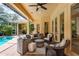 Inviting screened-in lanai provides ample seating and access to the pool area at 3042 Wentworth Way, Tarpon Springs, FL 34688