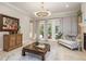 Comfortable living space offering natural light, neutral tones, and elegant furnishings at 3042 Wentworth Way, Tarpon Springs, FL 34688